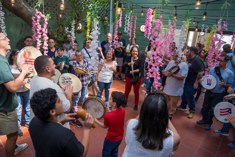 A group of people at an event playing instruments